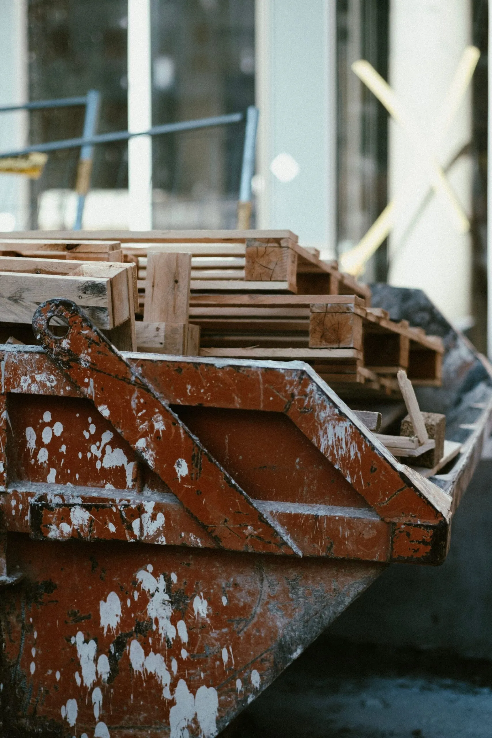 Construction debris and wood collected in a dumpster